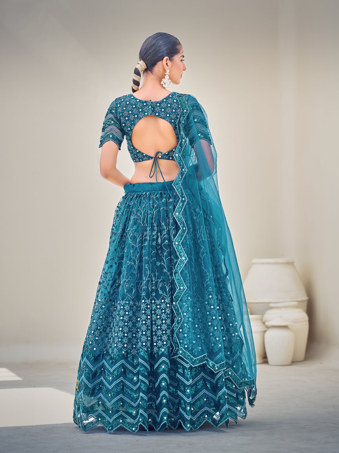 Blue Embroidered Sequined Semi-Stitched Lehenga Choli