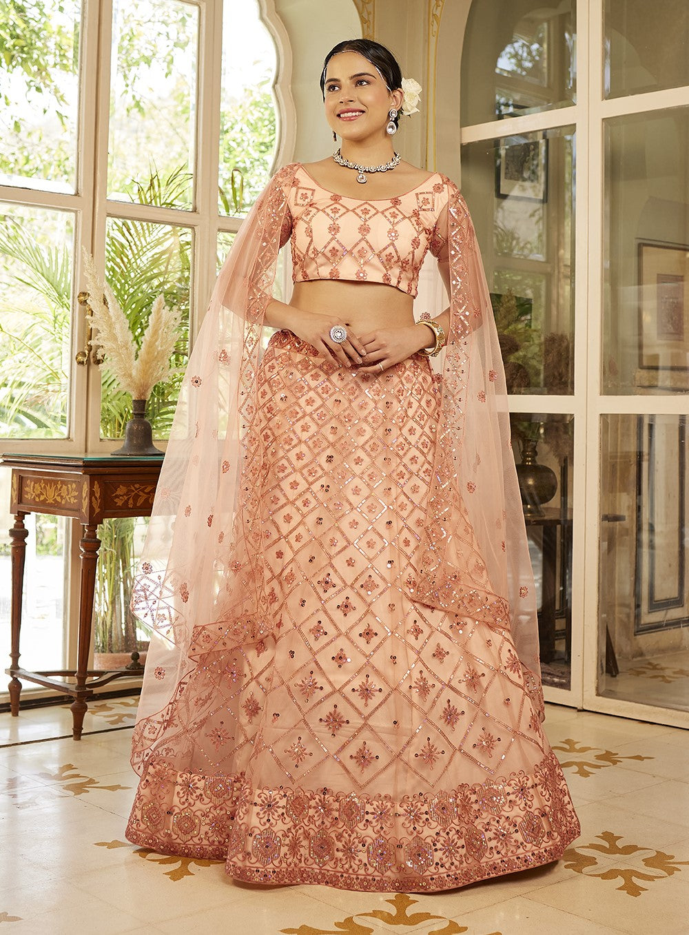 Fancy Peach Sequins Embroidered Net Lehenga Choli