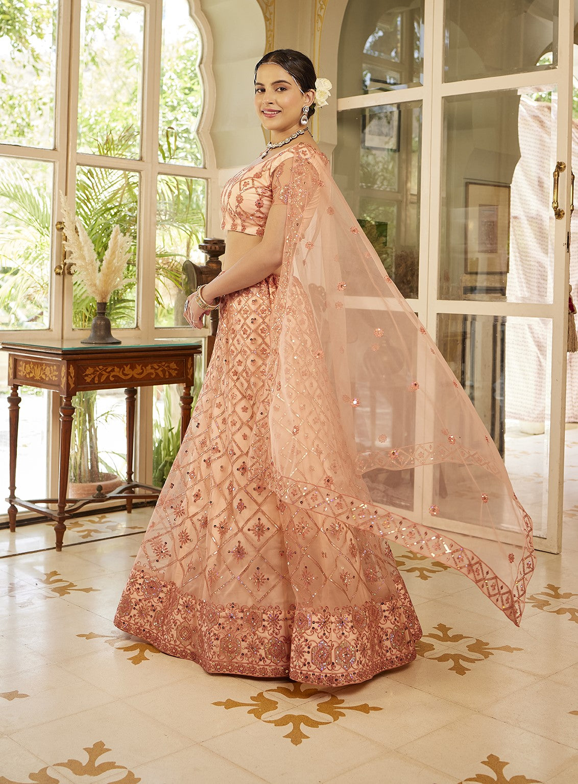 Fancy Peach Sequins Embroidered Net Lehenga Choli