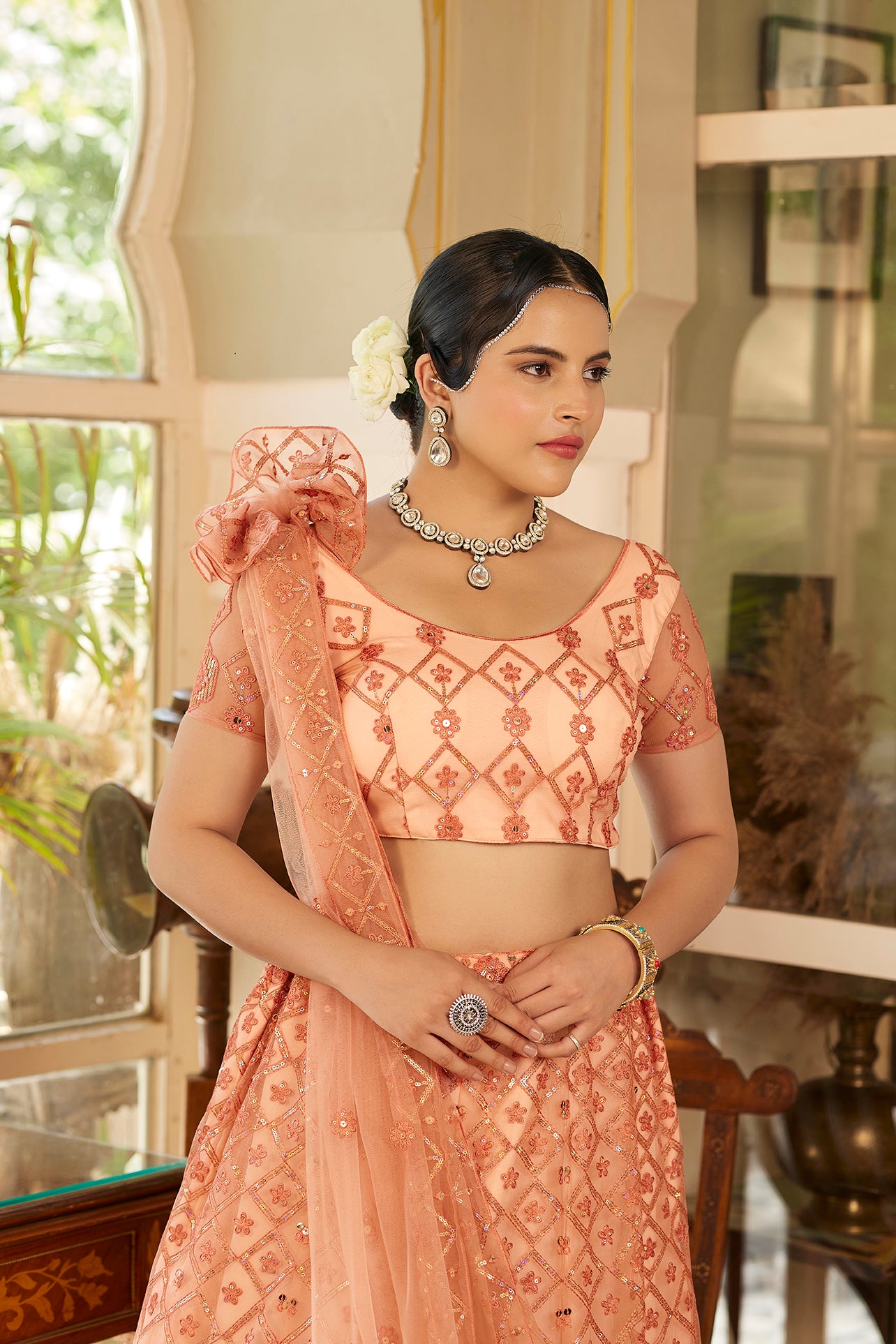 Fancy Peach Sequins Embroidered Net Lehenga Choli