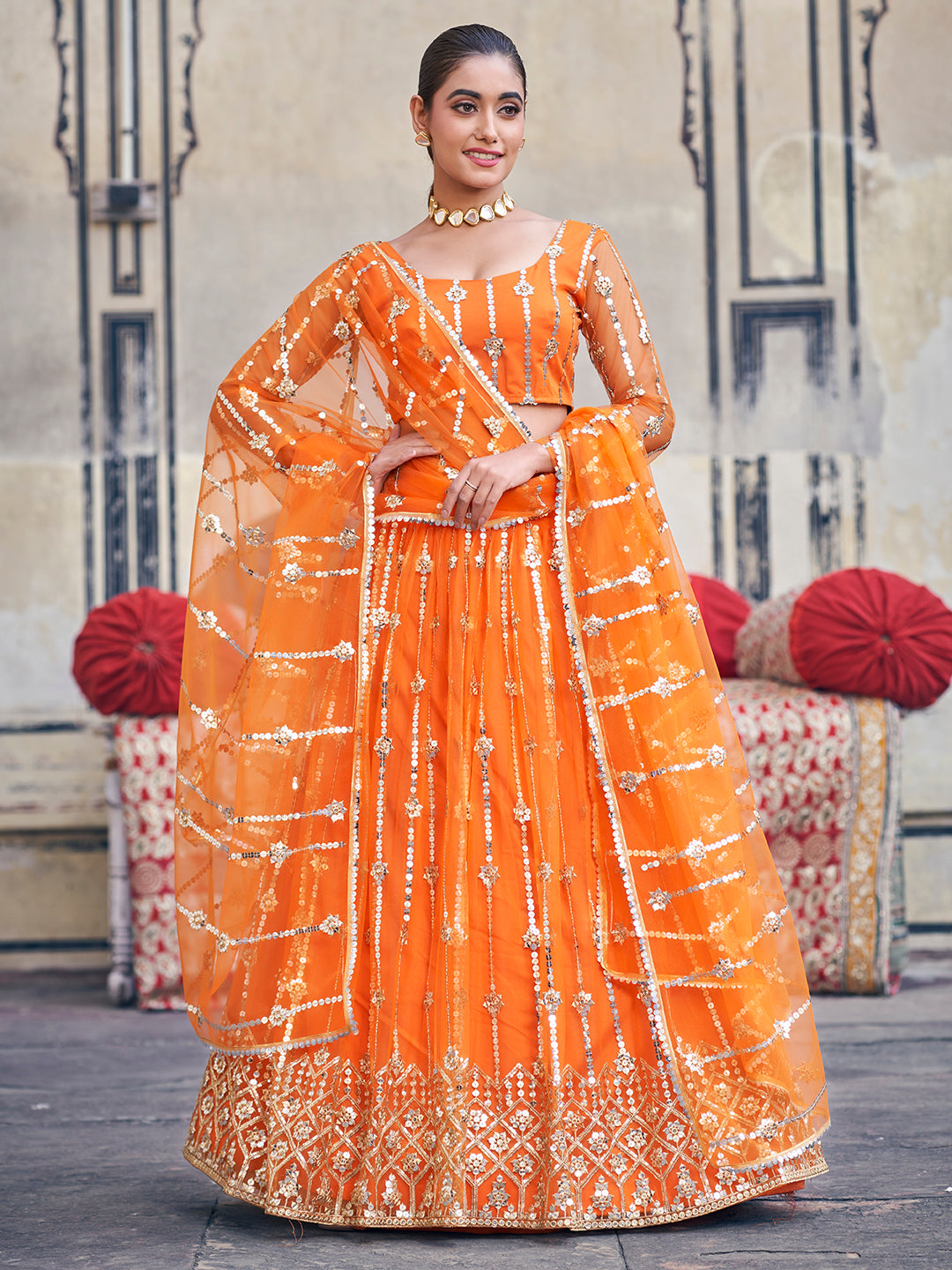 Stunning Orange Sequence Embroidered Soft Net Party Wear Lehenga Choli For Women