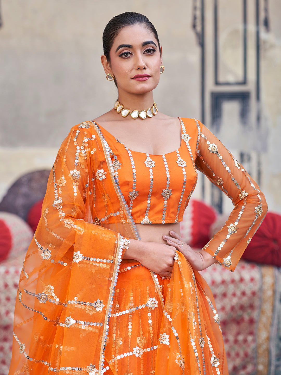 Stunning Orange Sequence Embroidered Soft Net Party Wear Lehenga Choli For Women