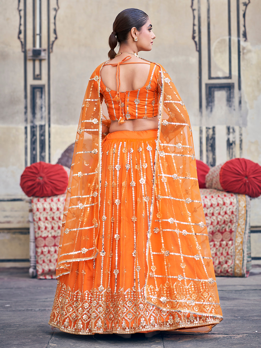 Stunning Orange Sequence Embroidered Soft Net Party Wear Lehenga Choli For Women